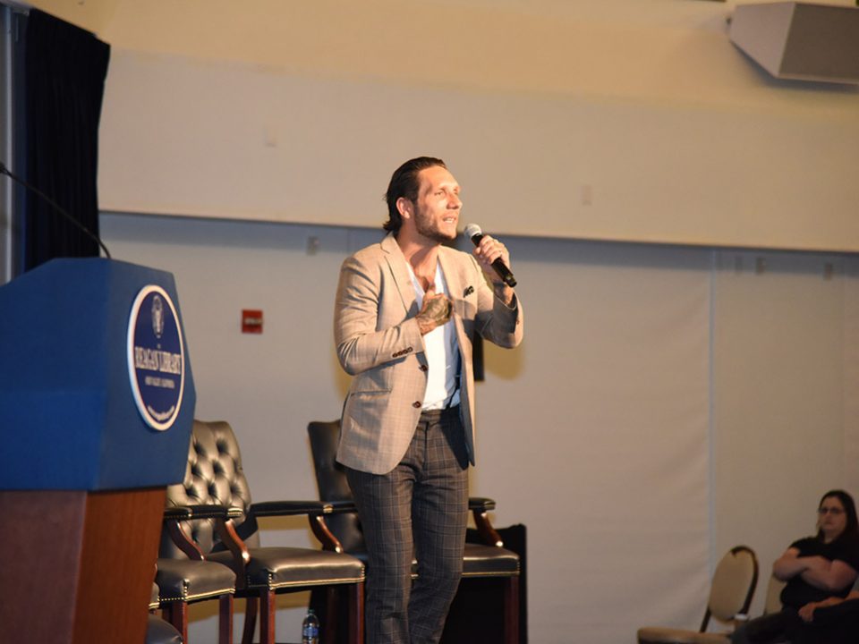 Brandon novak speaking at the DEA event