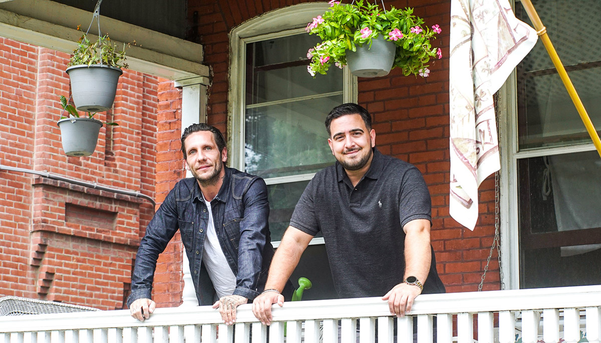 brandon novak and friend on the porch at Novak's house